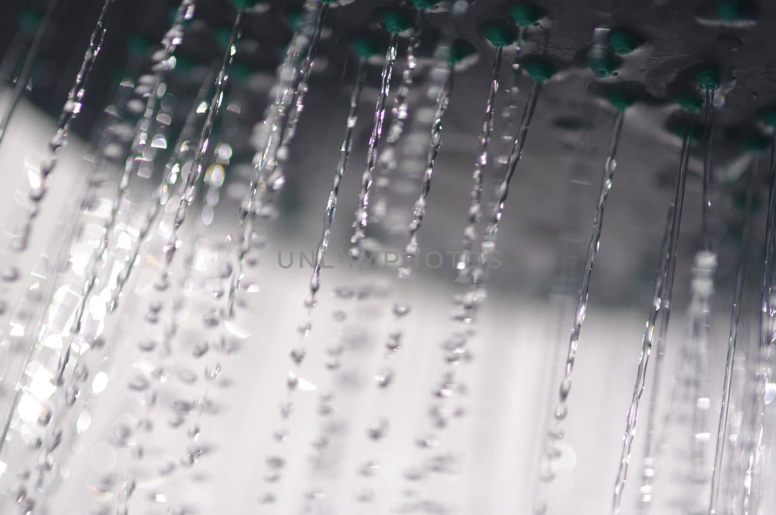 water drops falling from a shower indoors