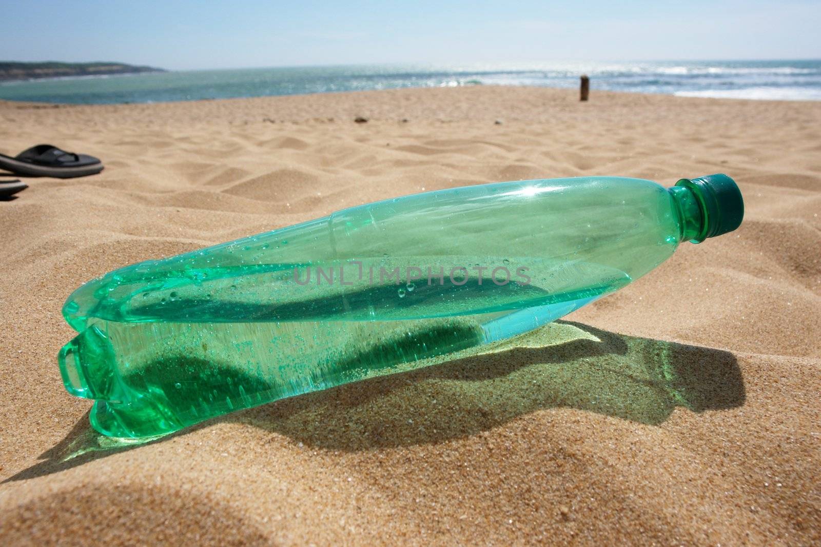 water bottle at the beach on a hot day