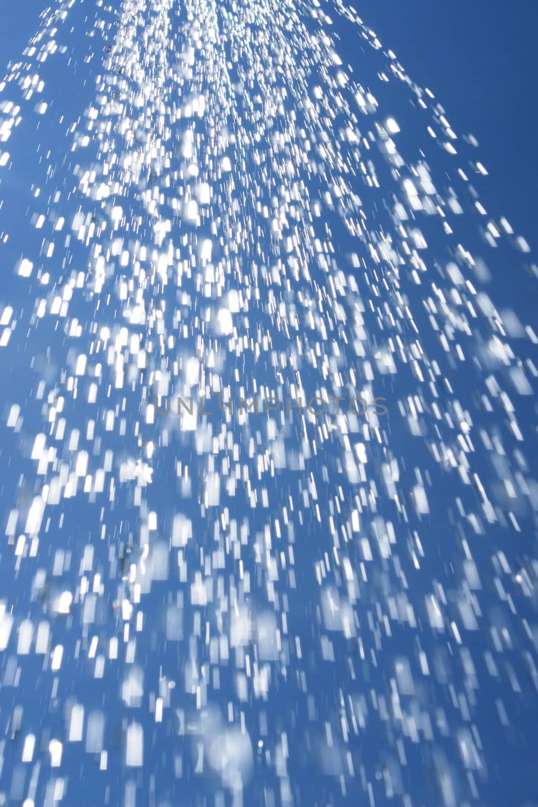 water drops falling from a shower outside