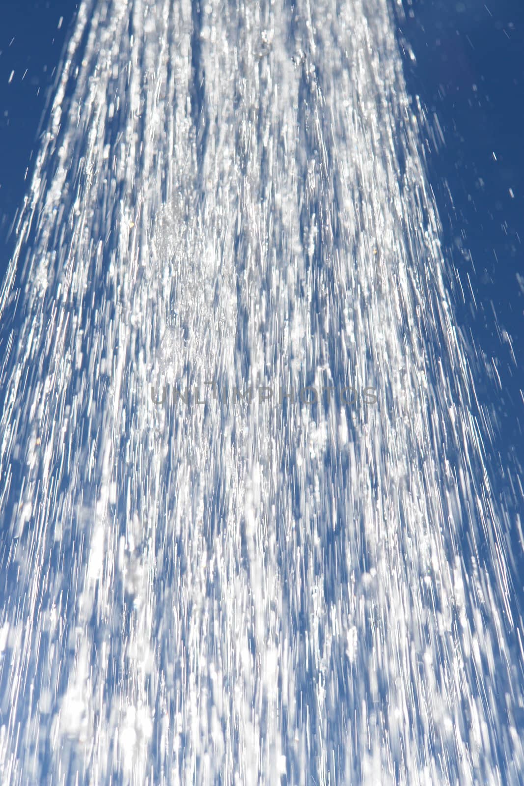 water drops falling from a shower outside