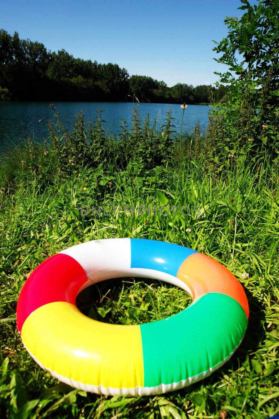 swim ring floating on beautiful blue lake