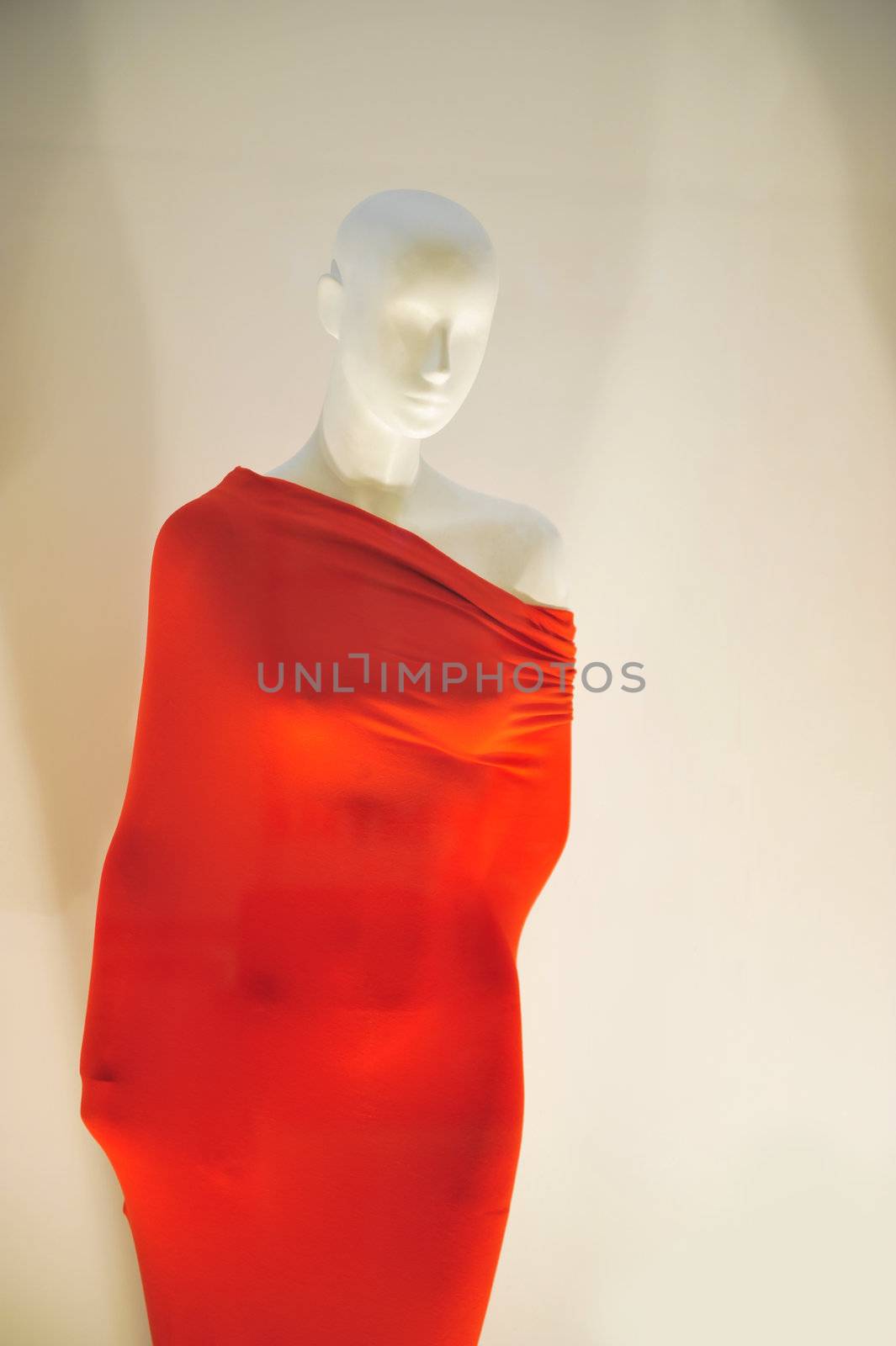 mannequin wrapped in red material