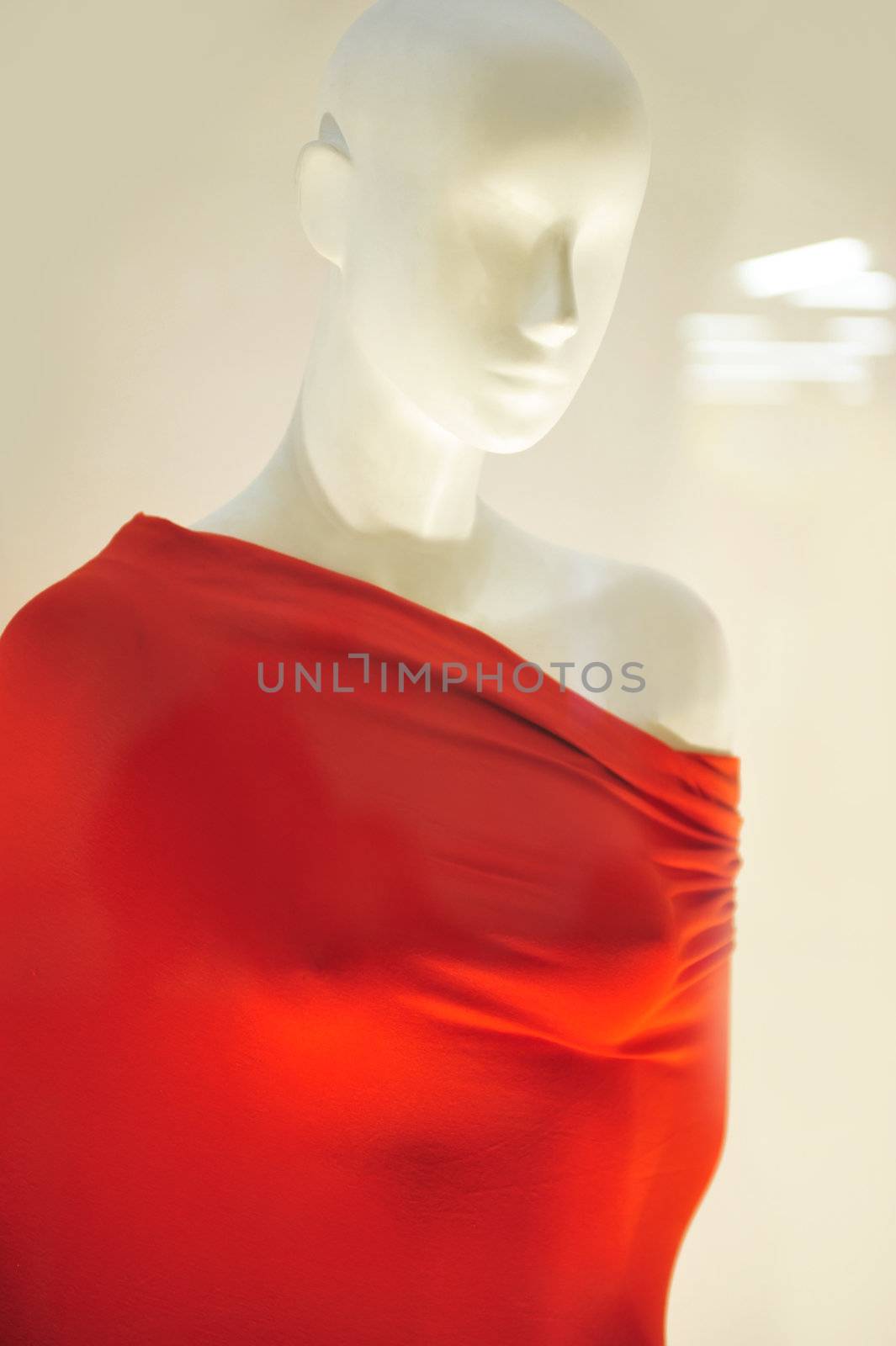  mannequin wrapped in red material