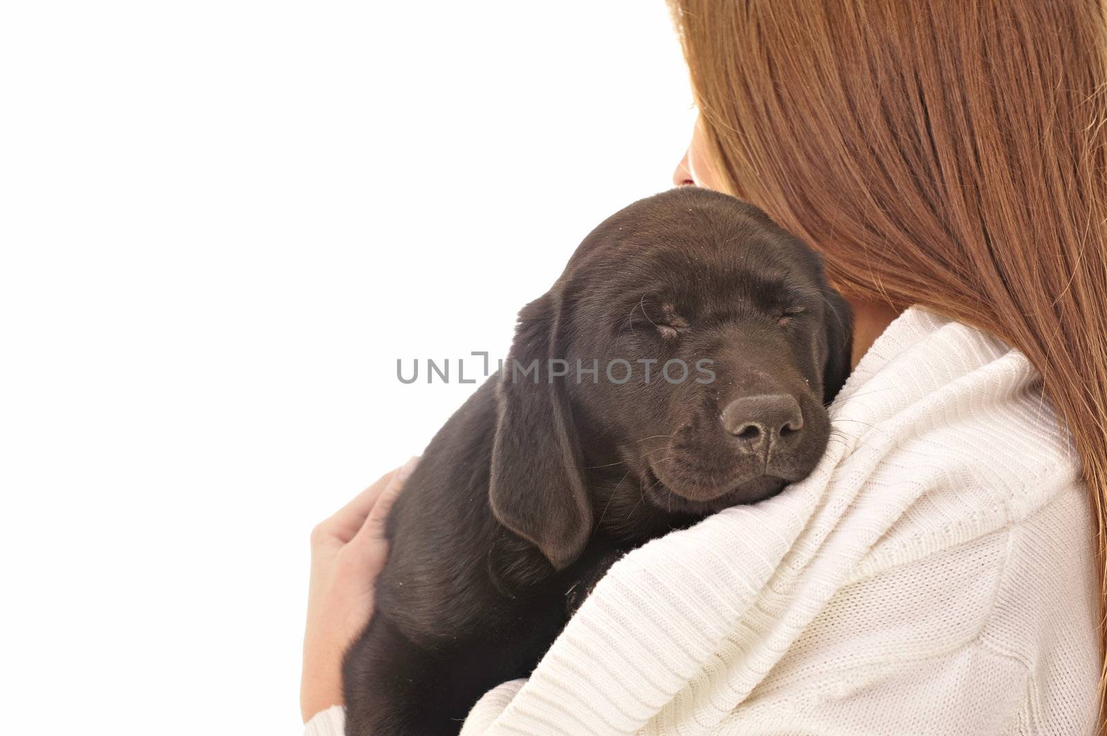 Cheerful young woman with her puppy isolated on white background