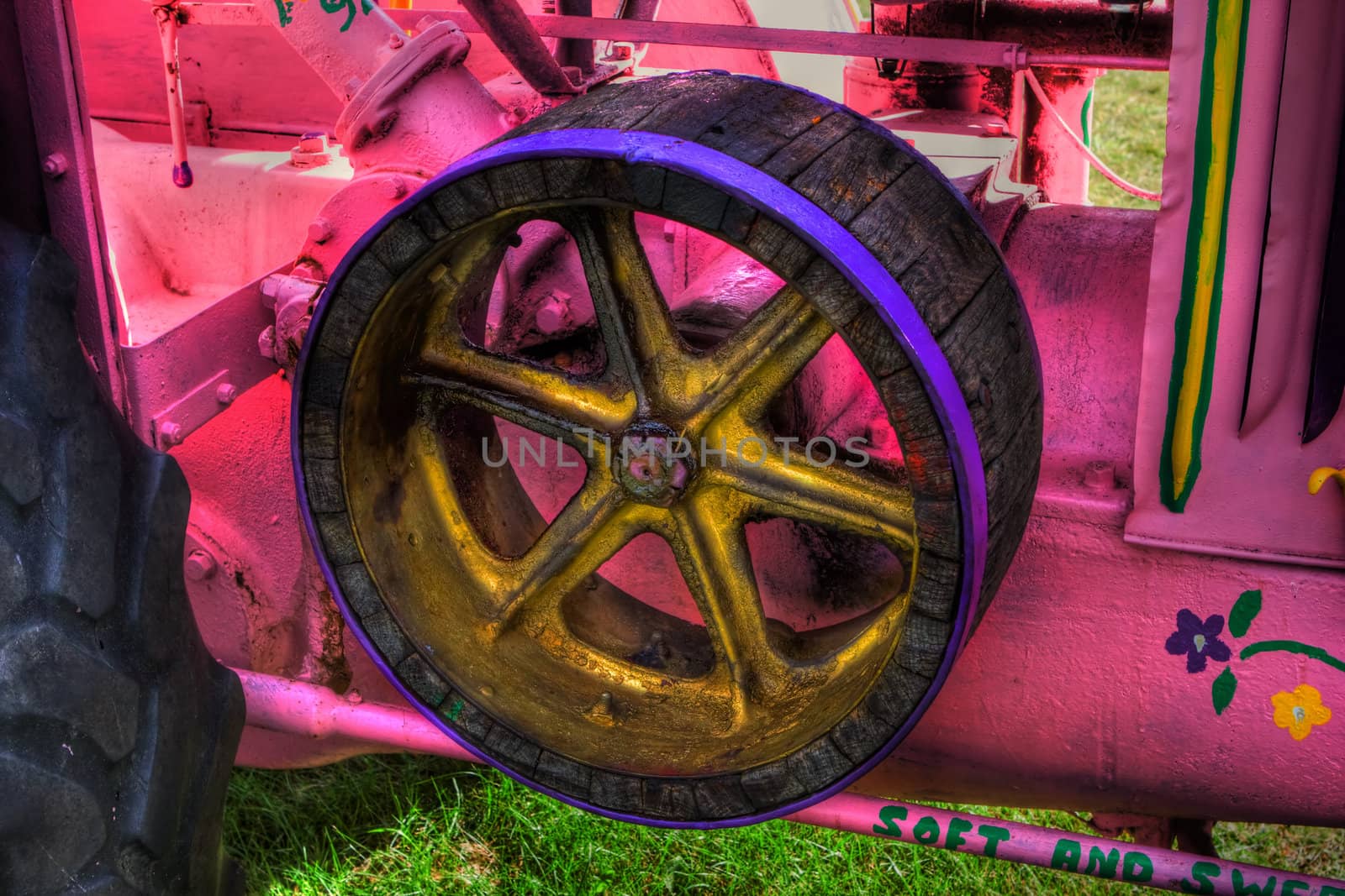 HDR image of the side of a vintage farm tractor. by Coffee999