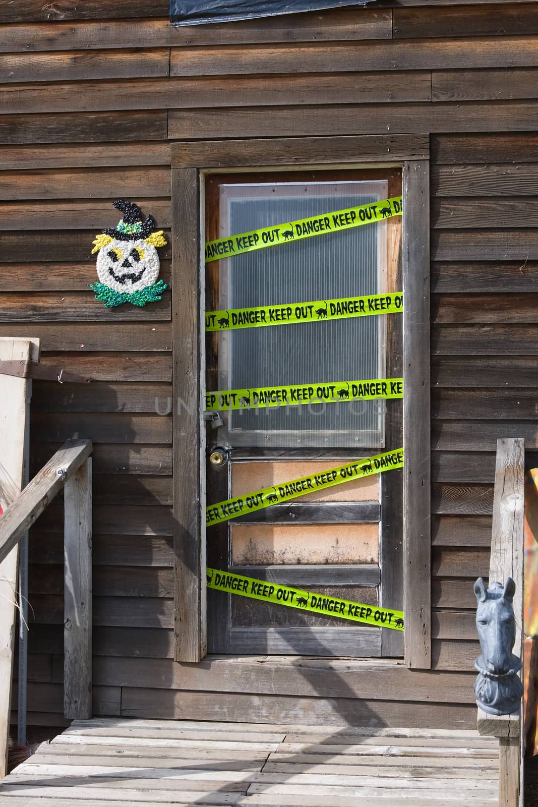 Keep-Out and Danger Tape on a Haunted House door.