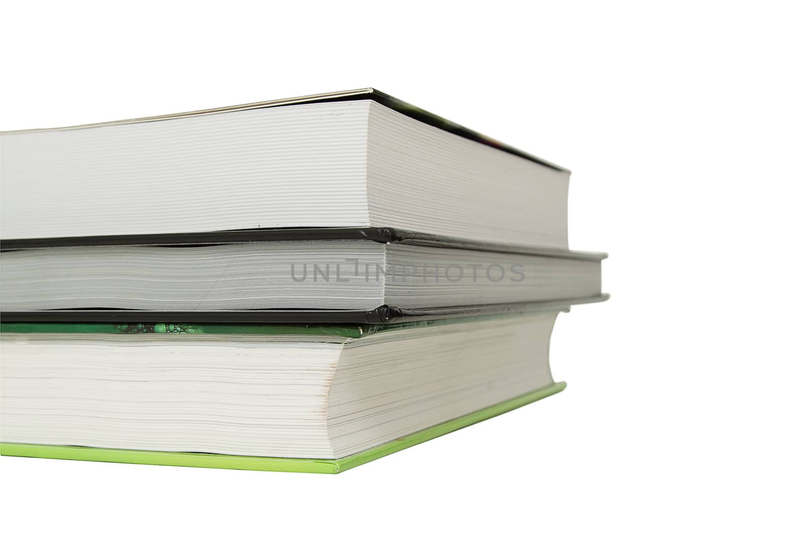 Stack of three books over white background
