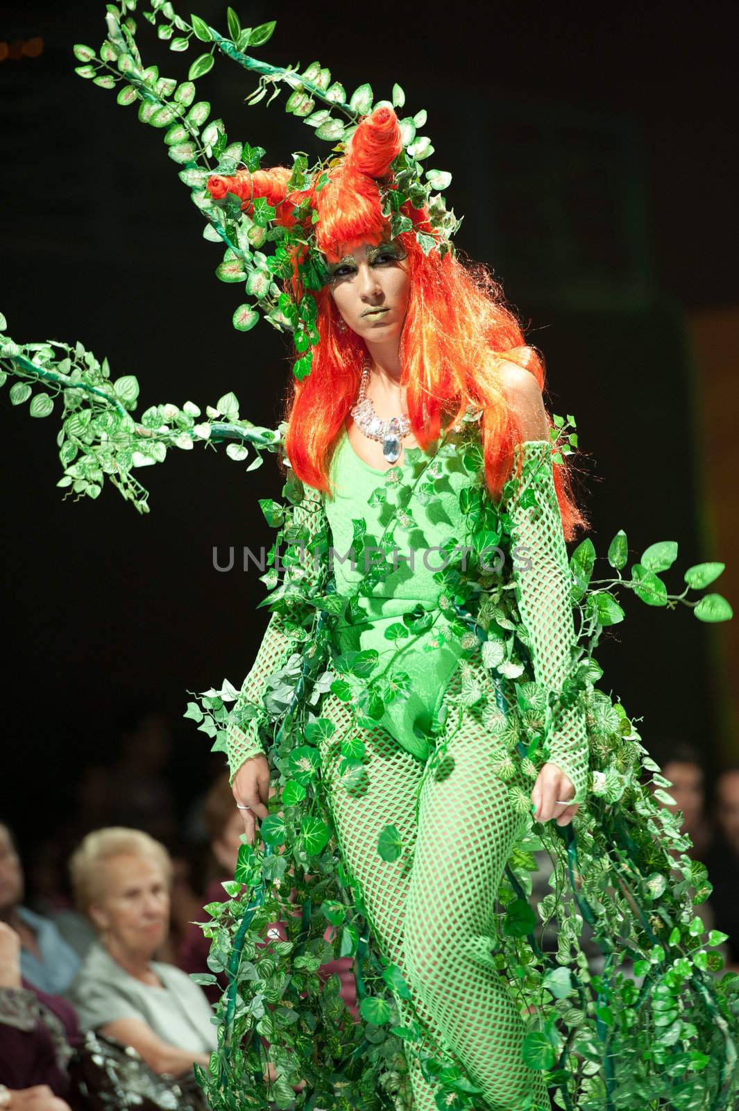 CANARY ISLANDS - 28 OCTOBER: Model on the catwalk wearing carnival costume from designer Augustin Munoz during Carnival Fashion Week October 28, 2011 in Canary Islands, Spain