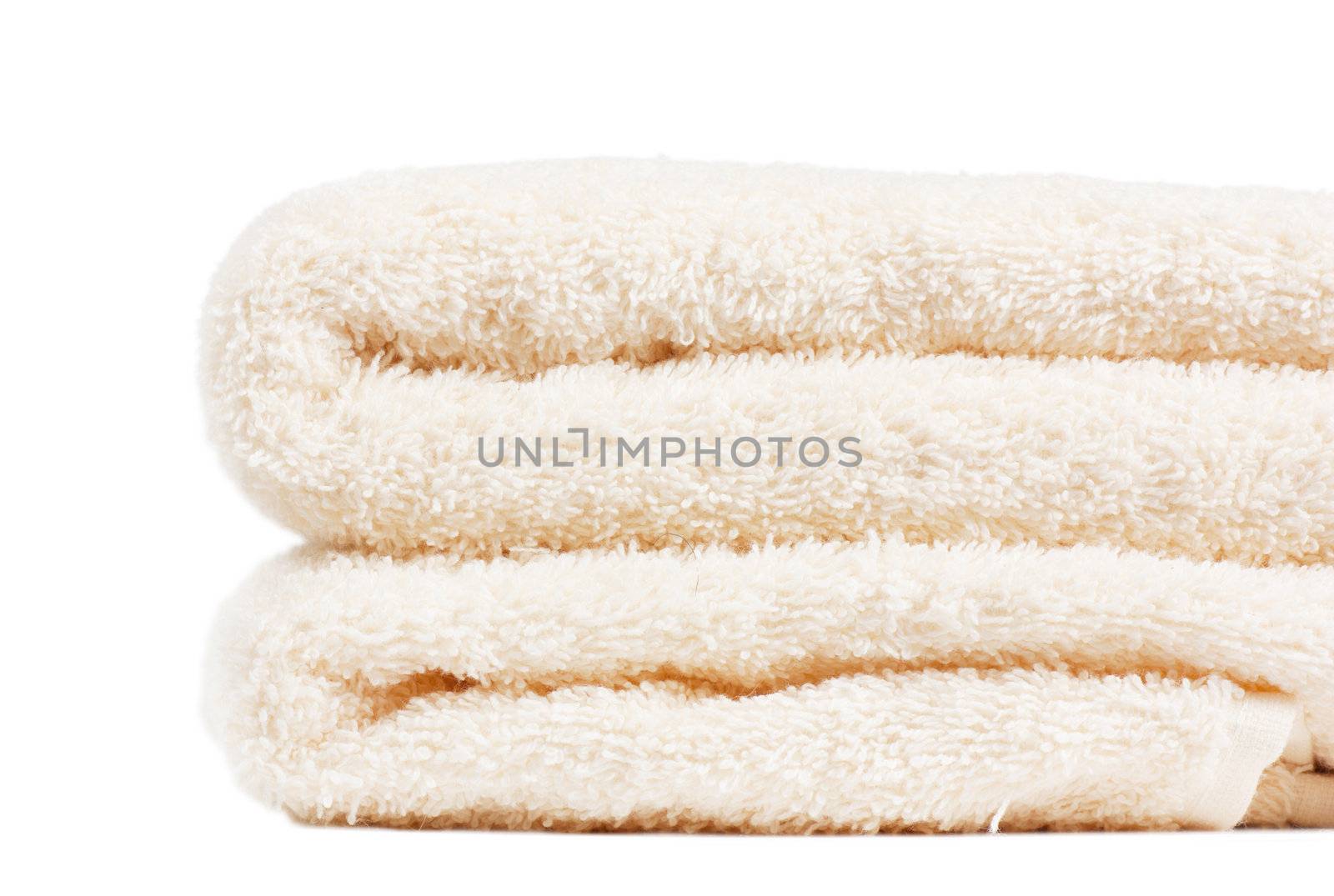 Stack of white towels over white background