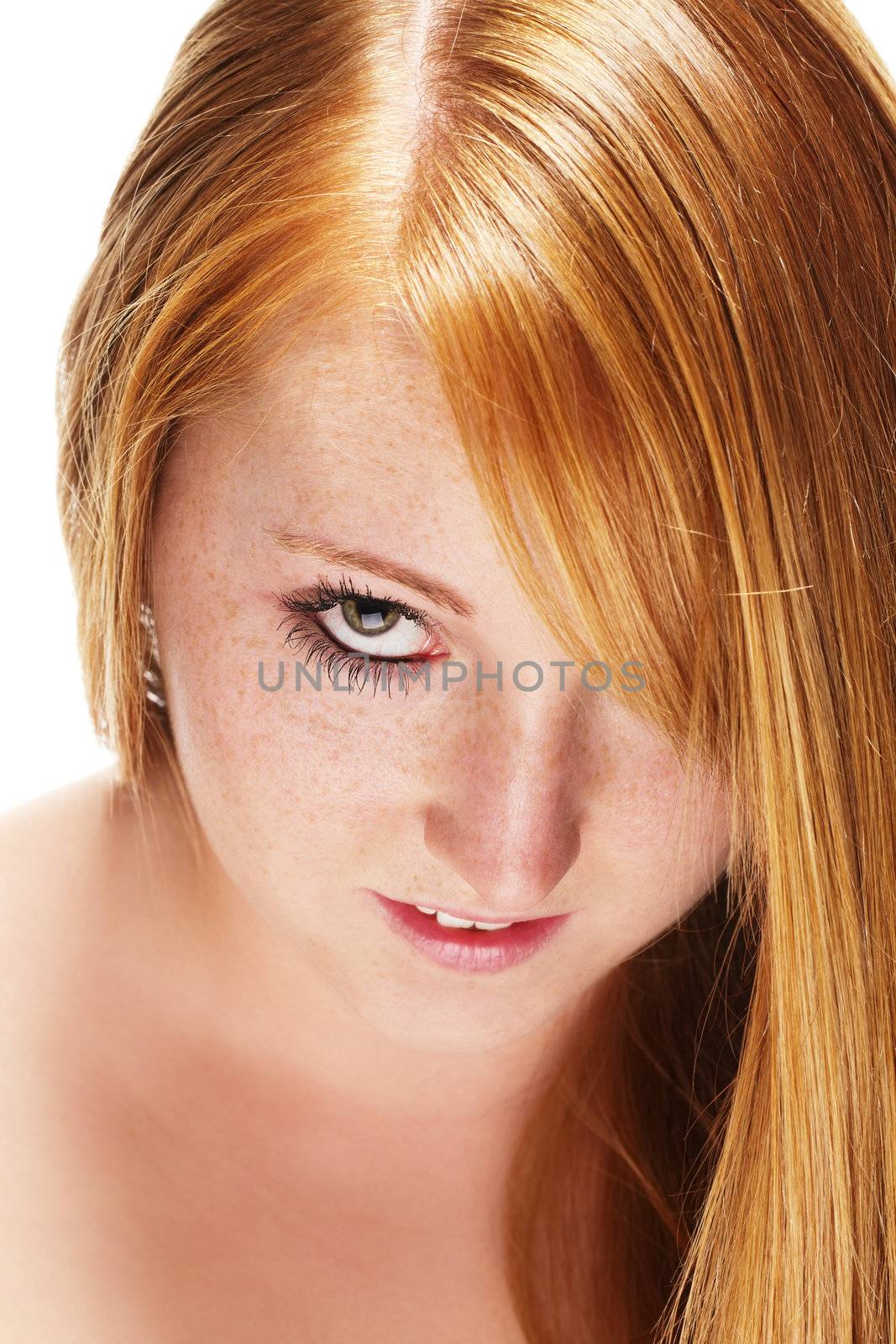 portrait of a redhead girl with beautiful hair on white background