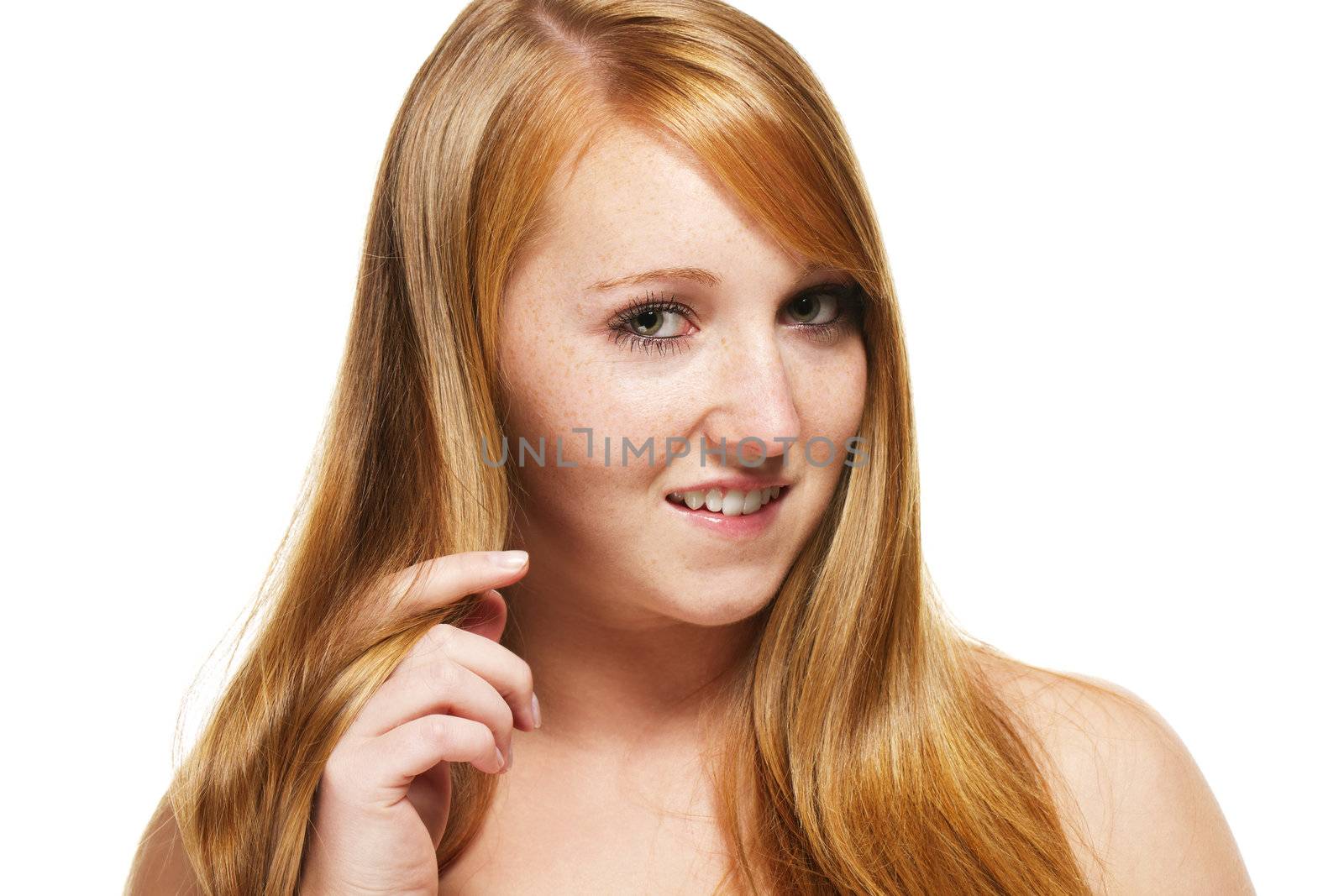 young redhead woman playing with her hair on white background
