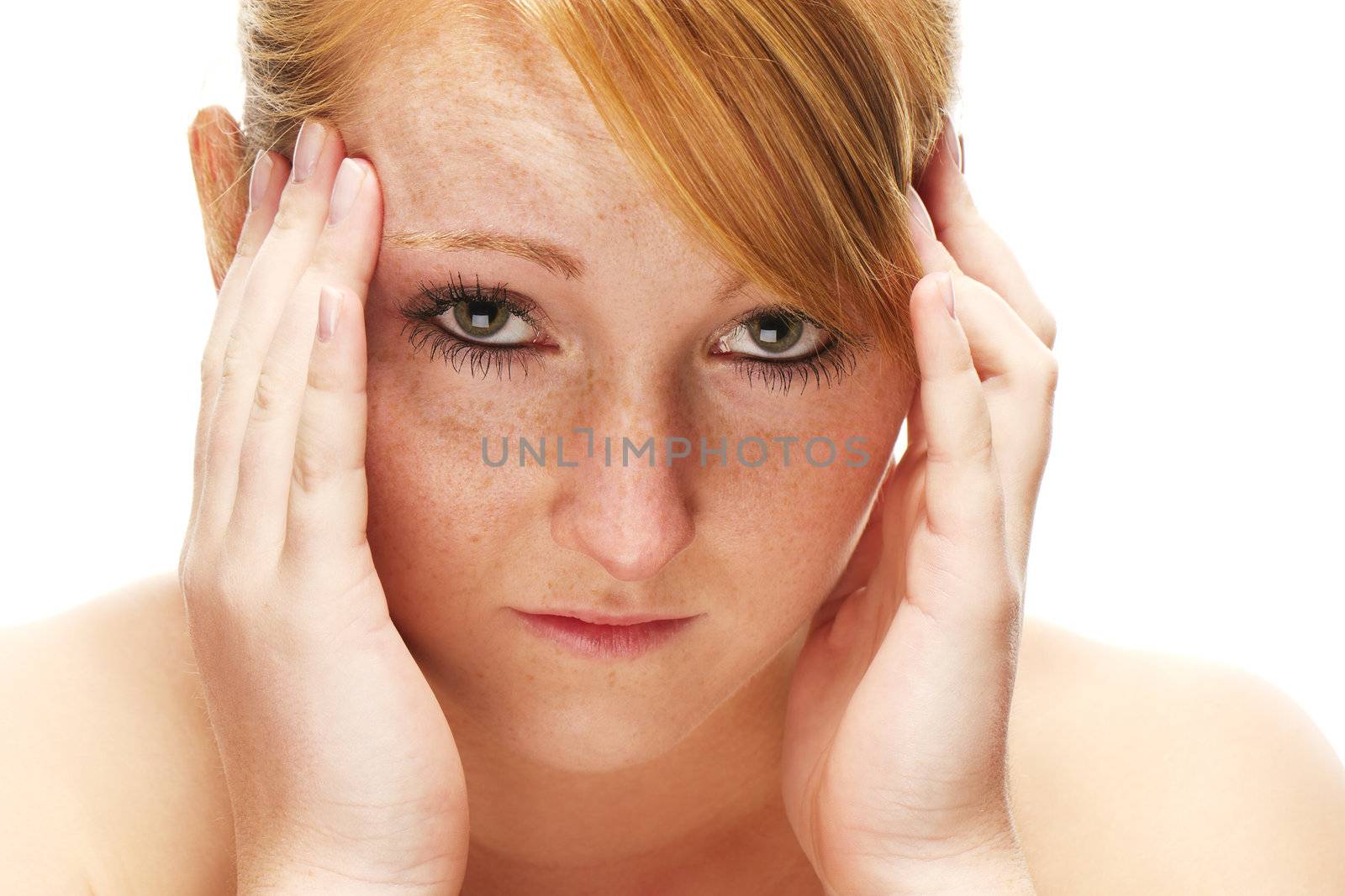 young redhead woman suffering on headache on white background