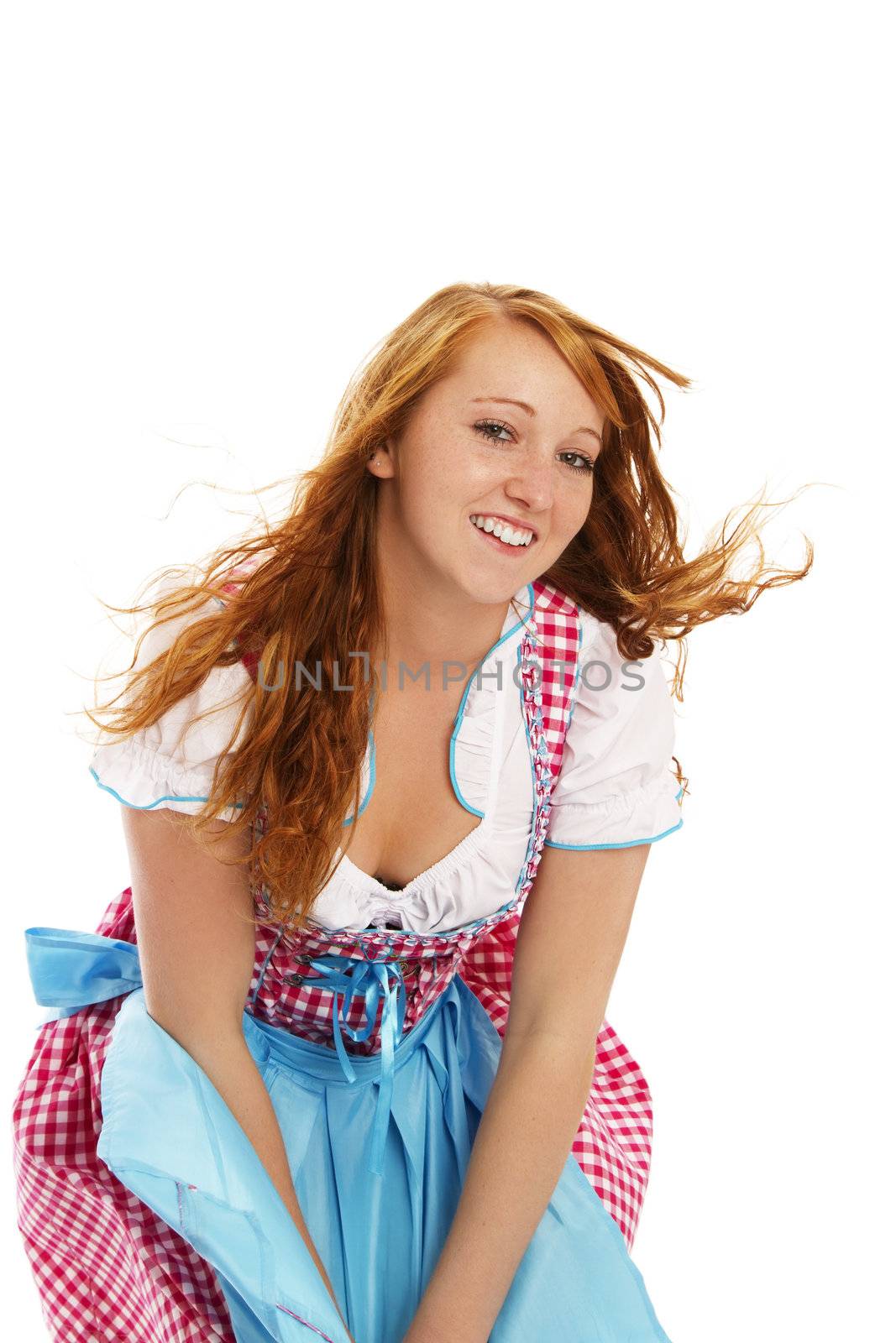 woman in bavarian dress handling with wind on white background