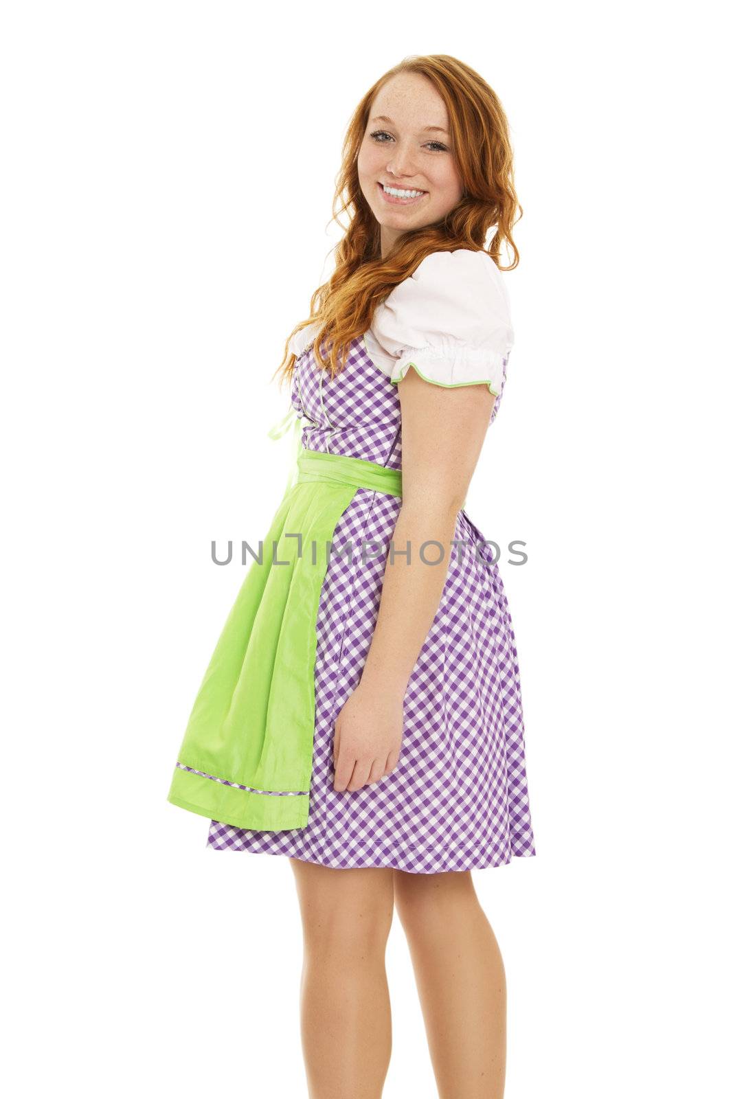 young woman in bavarian dress turning around on white background