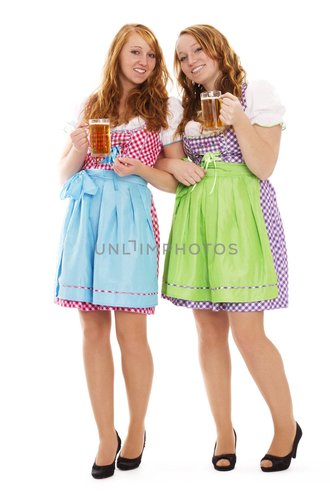 two standing bavarian woman with beer on white background