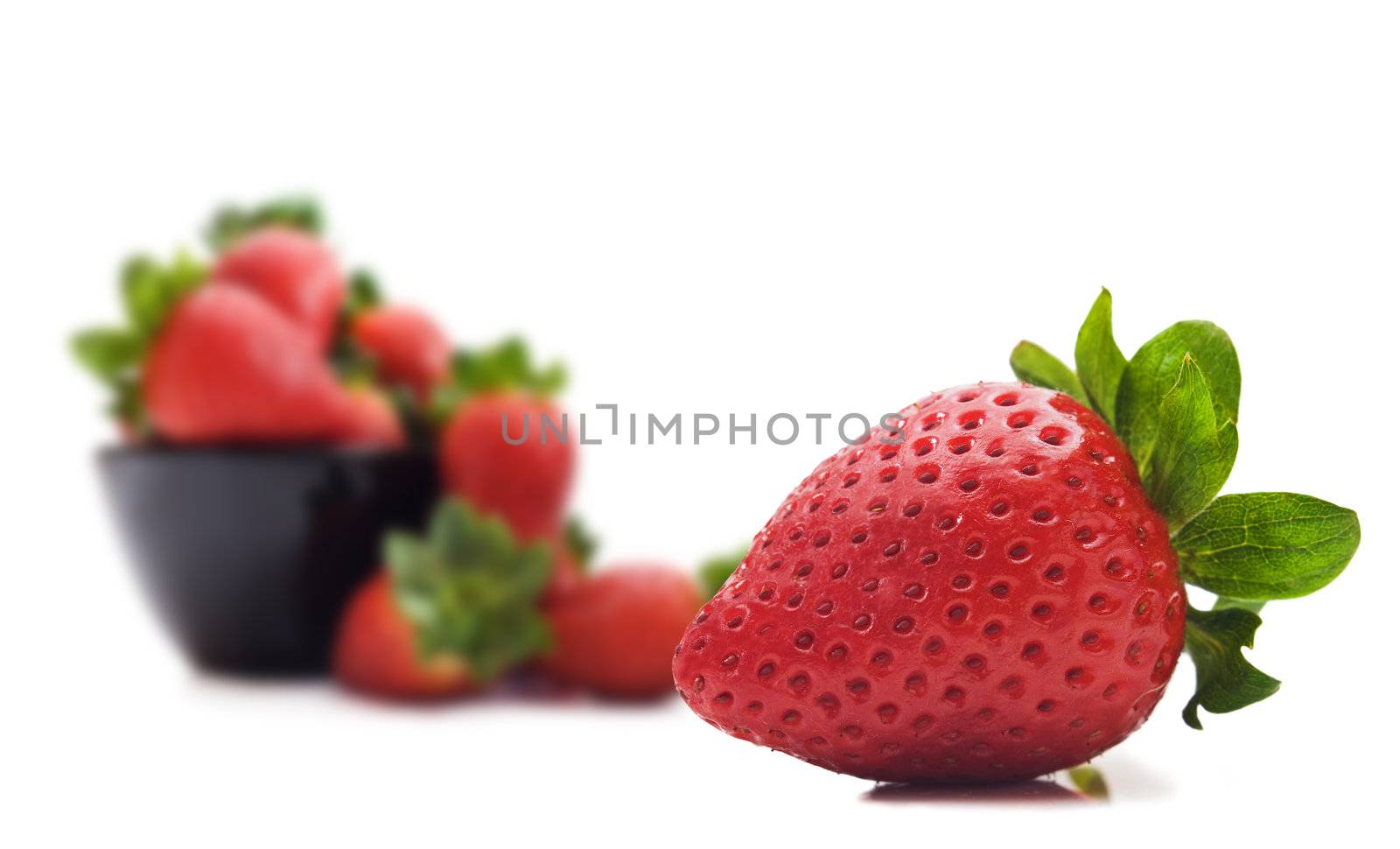 Fresh strawberries on a white background by tish1