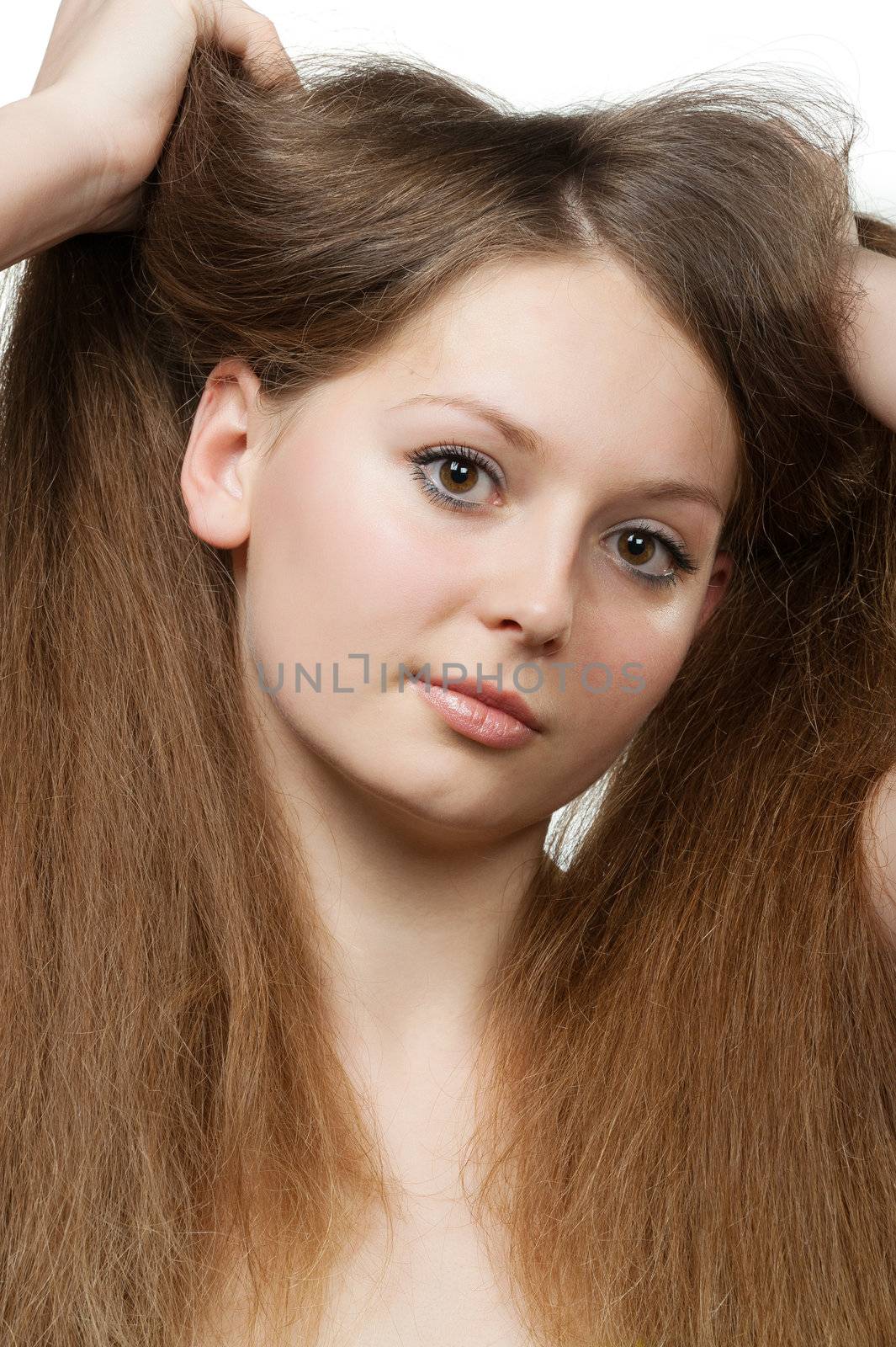 The beautiful girl with long healthy hair. It is isolated on a white background