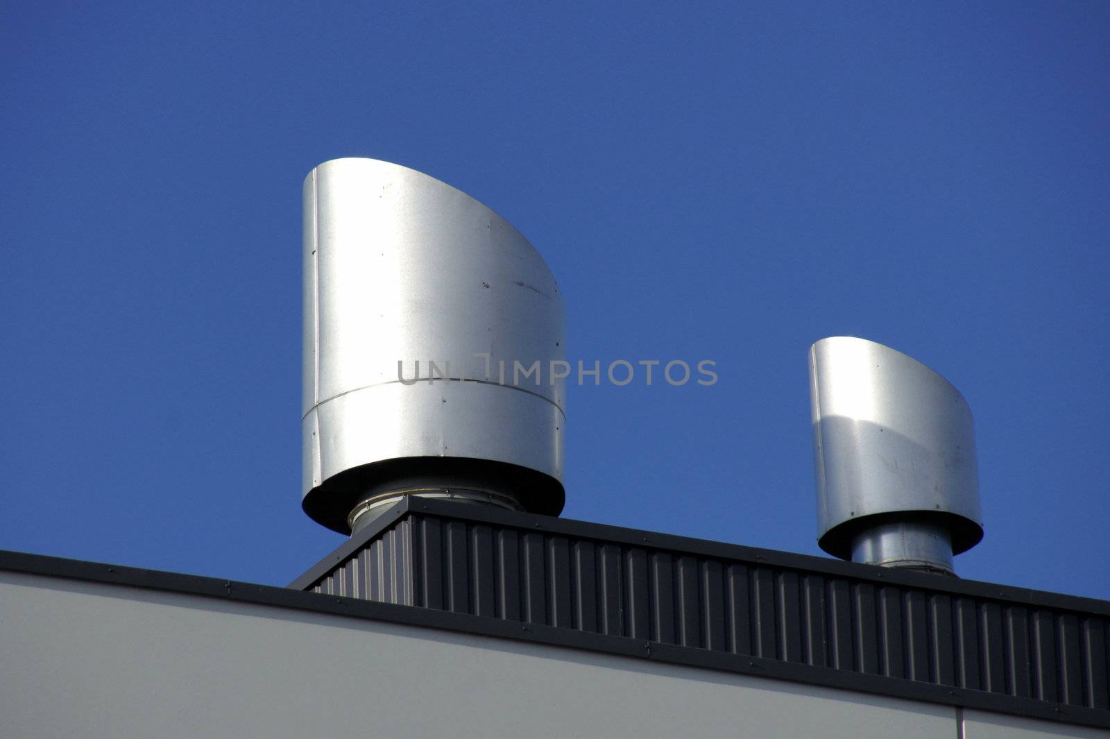 Vents of ventilation are located on a roof of a  building