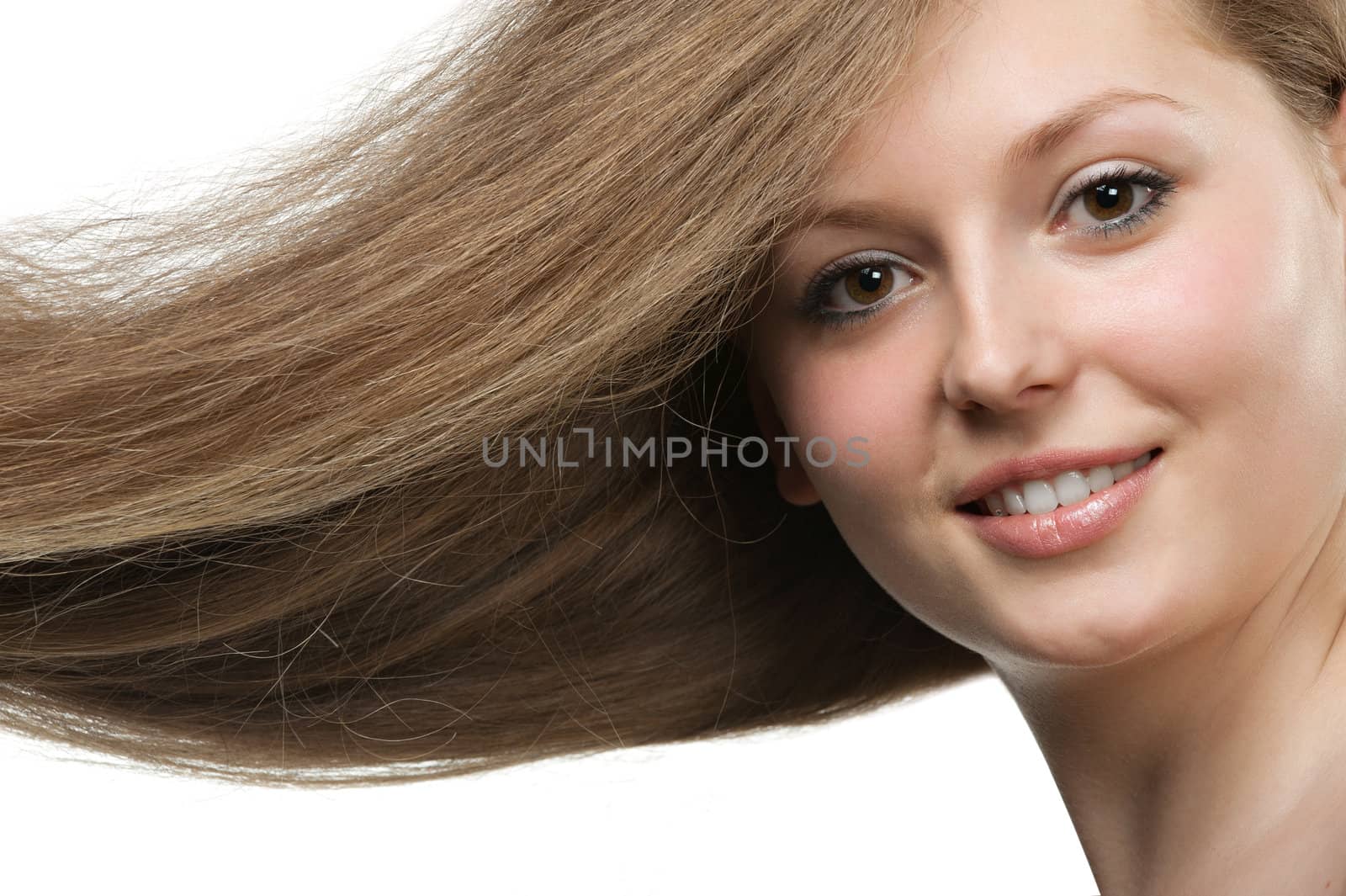 Healthy beautiful long hair closeup in motion created by wind. Portrait