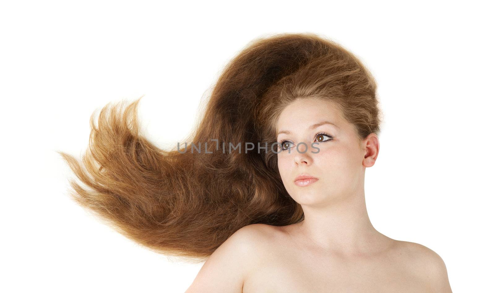 Healthy beautiful long hair closeup in motion created by wind. Isolated on white