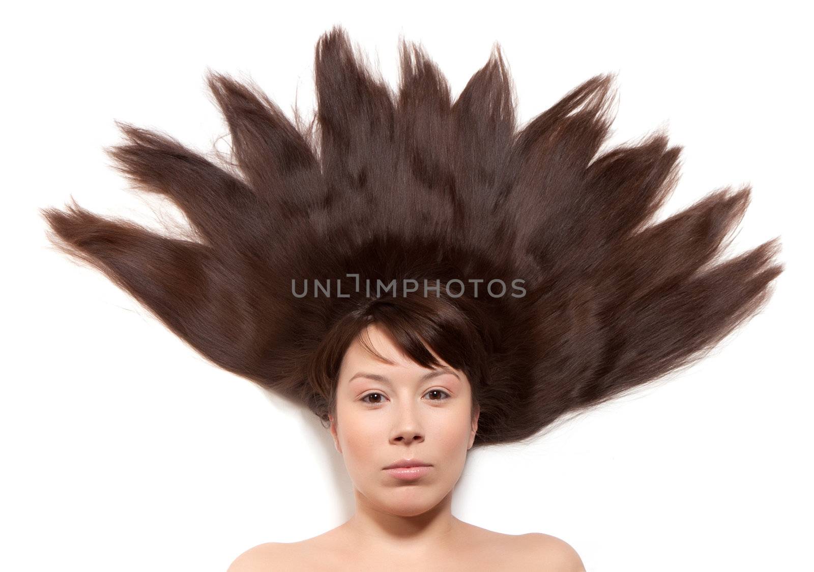 woman with long brown hair lying on the floor