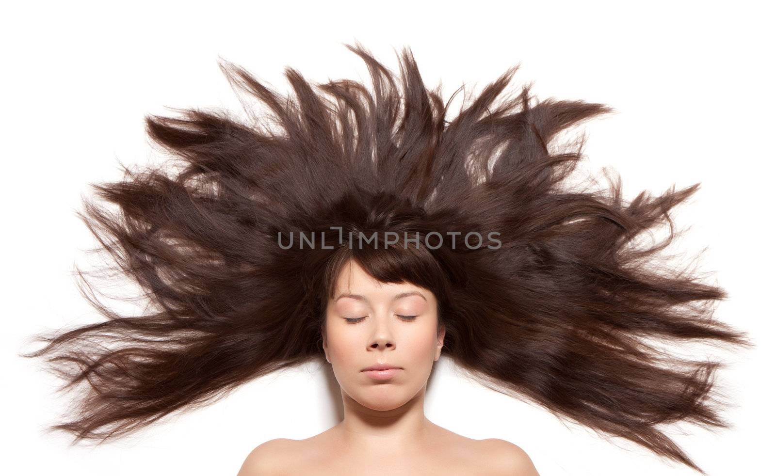 
Woman with long hair straightened on the floor around the head