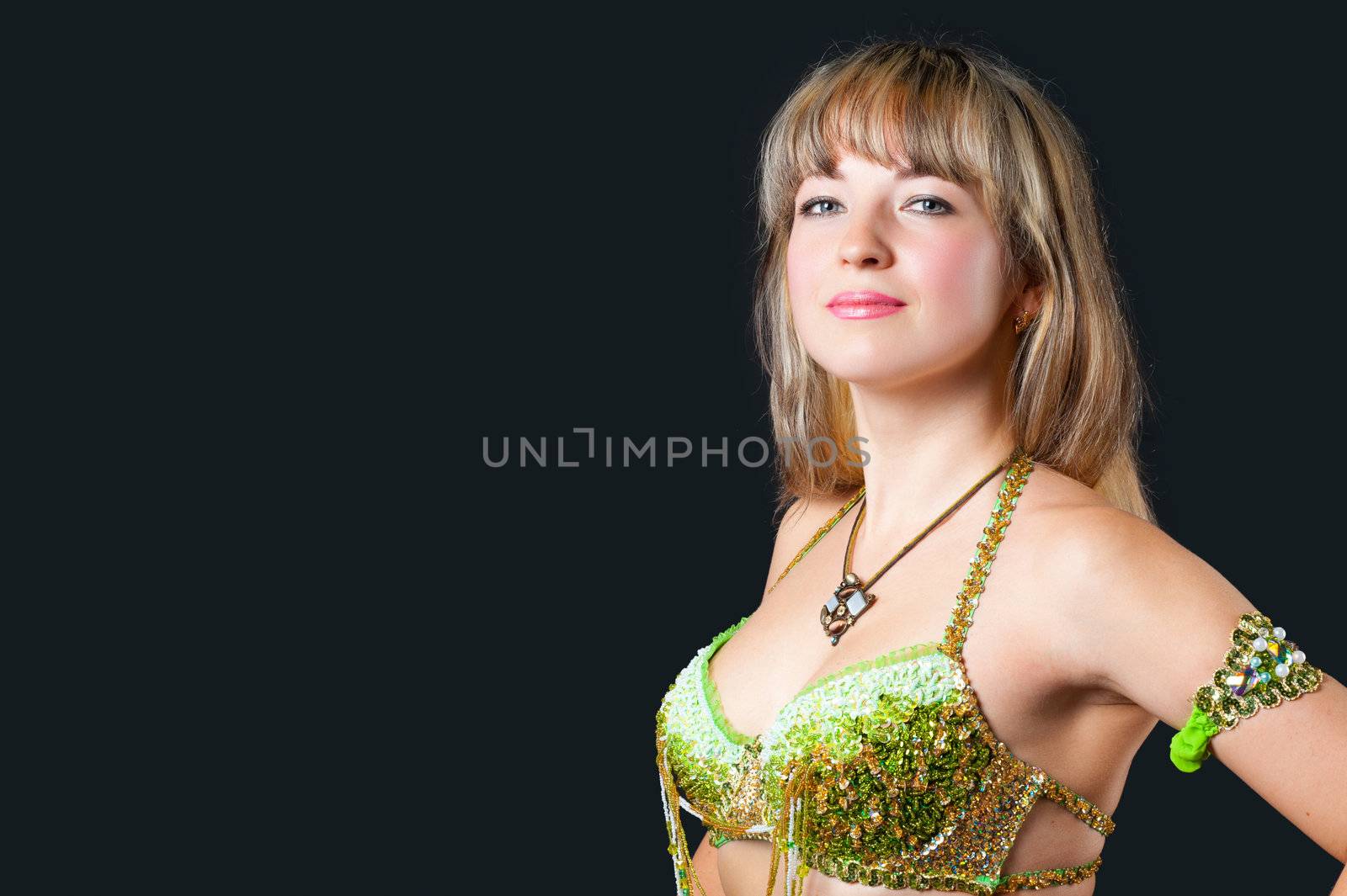 The attractive woman in underwear. Isolated on black background