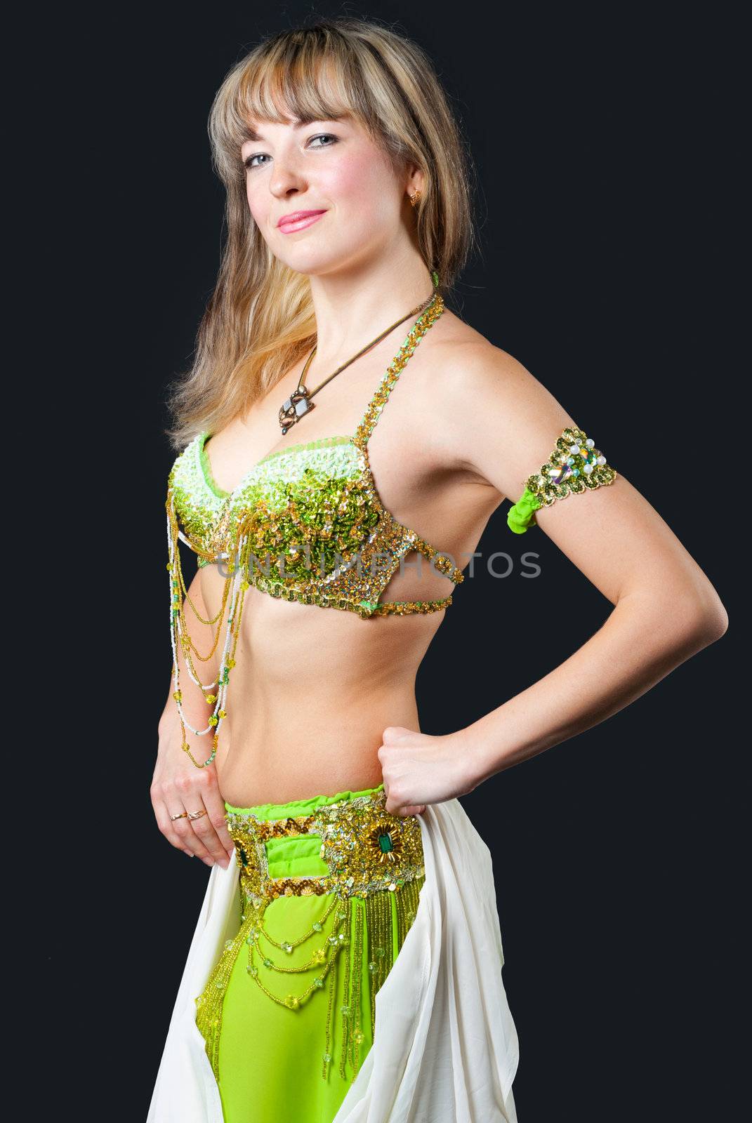 The woman in east dancing suit. Isolated on black background