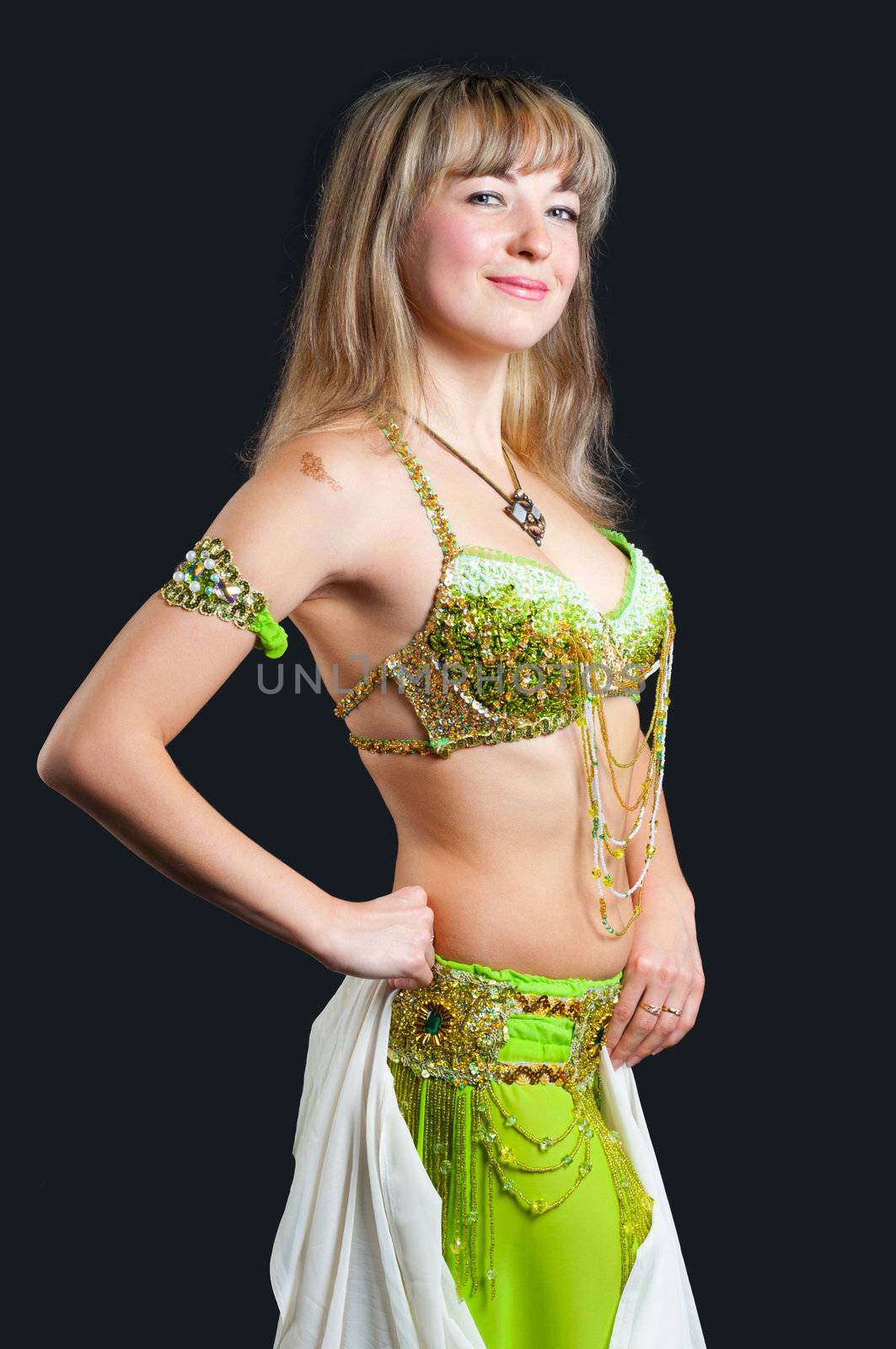 The woman in east dancing suit. Isolated on black background