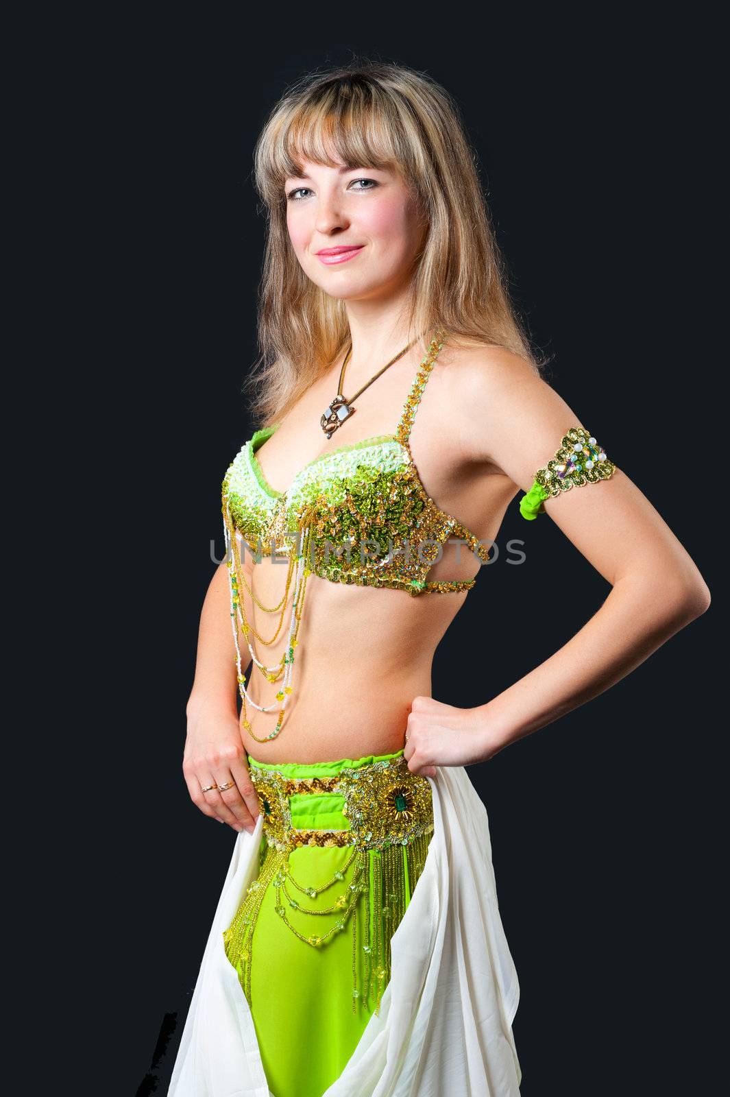 The woman in east dancing suit. Isolated on black background