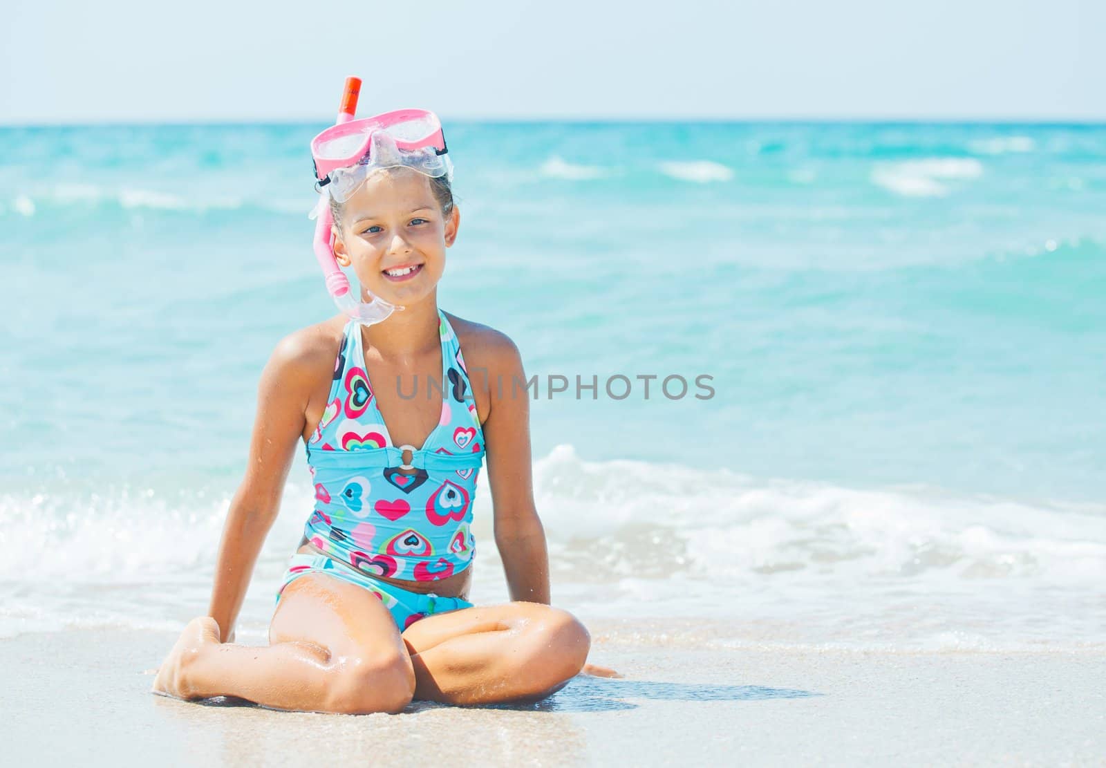 Portrait of a cute girl wearing a mask for diving background of the sea