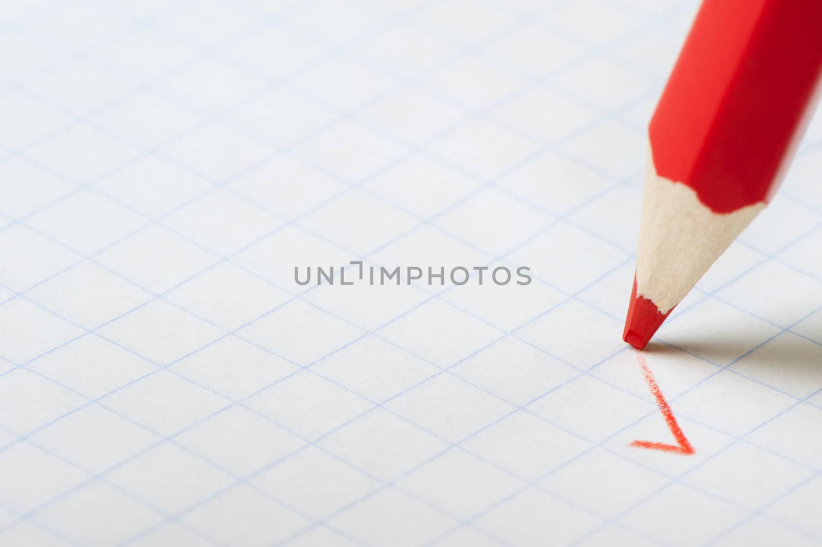 Red pencil writing a mark. Abstract concept