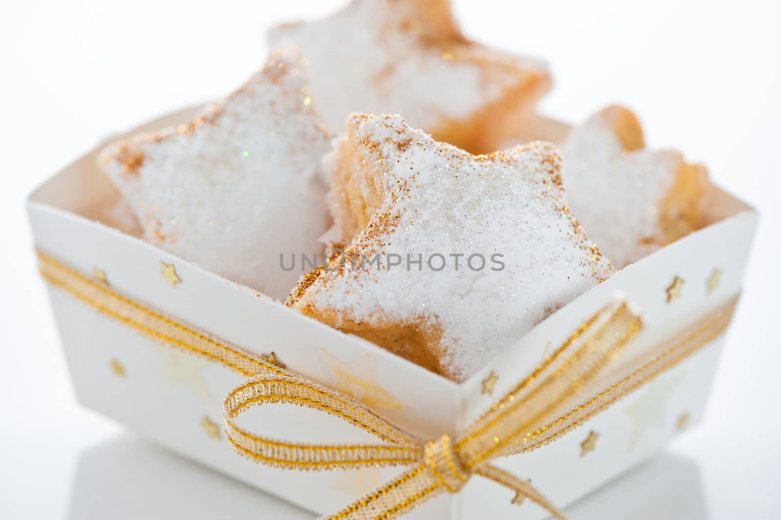 Christmas cookies in a box with gold stars