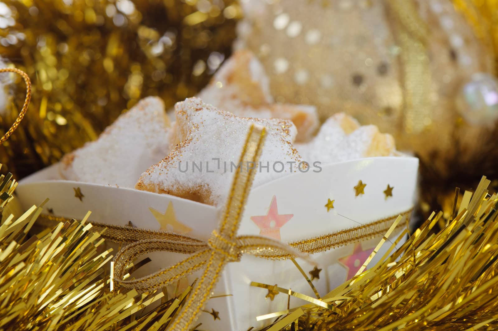 Christmas cookies in a box with gold stars