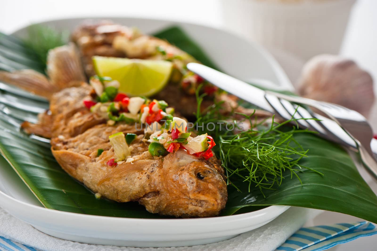 Fresh fried fish with chili sauce garlic and dill