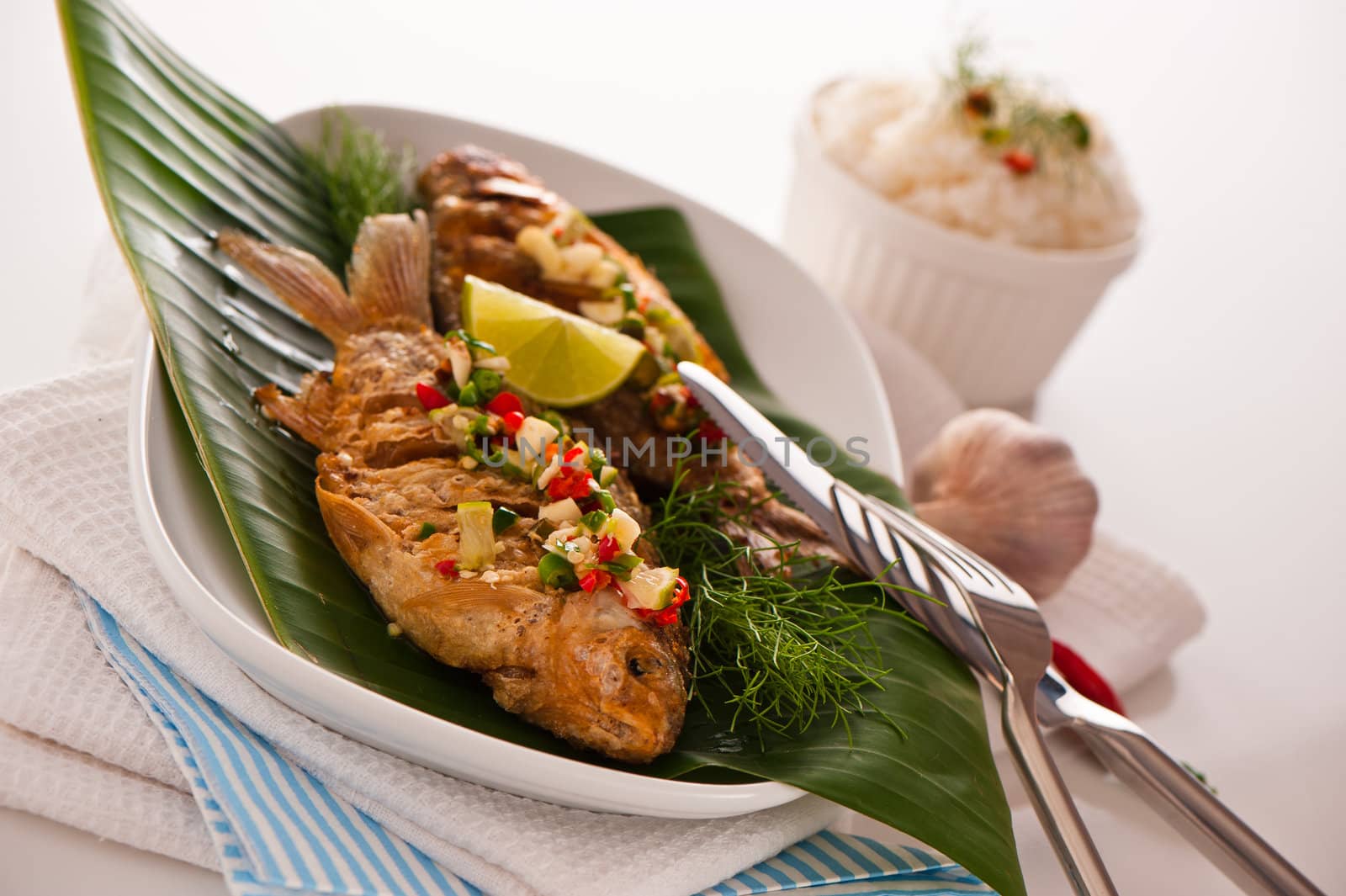 Fresh fried fish with chili sauce garlic and dill