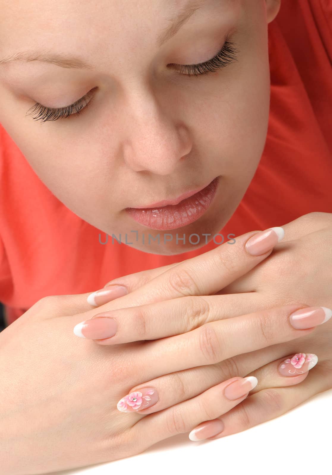 Manicure. Well-groomed female hands with a decorative element - a flower