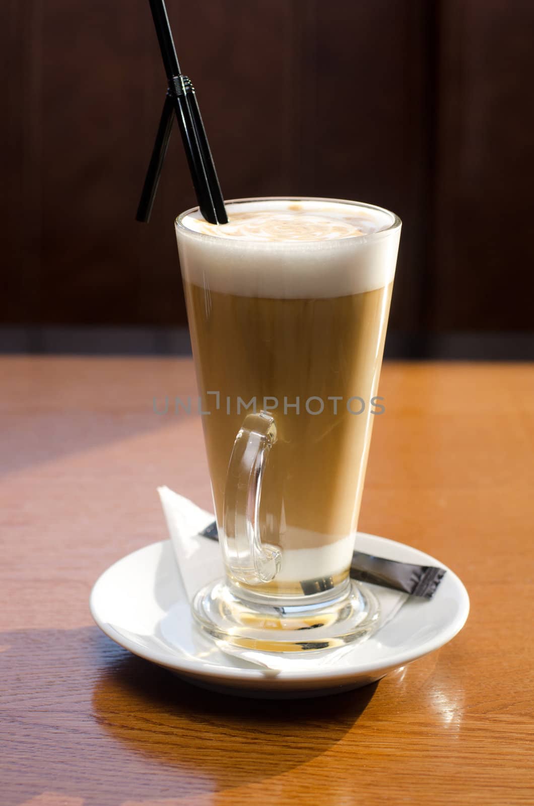 Latte coffee cup closeup at the table
