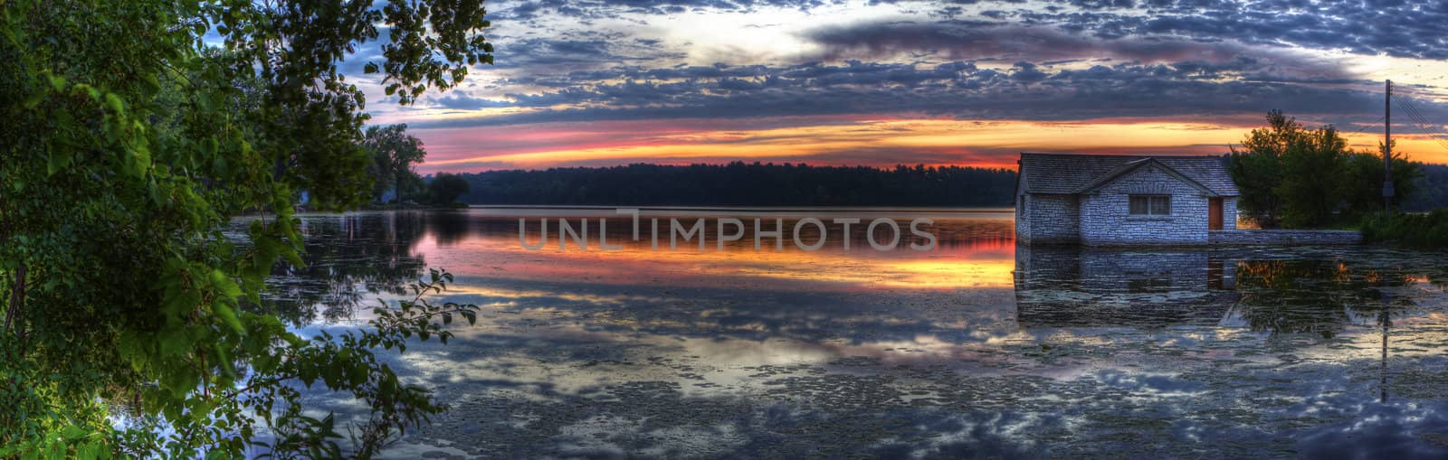 Panorama of a sunrise on a lake by Coffee999