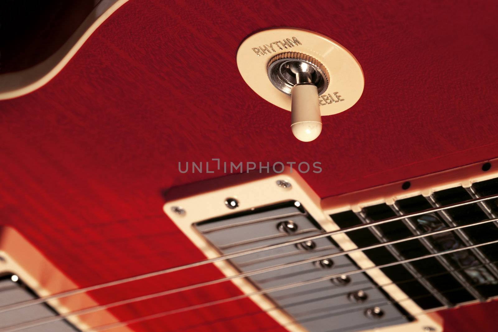 Close-up of the rhythm, treble switch on an electric guitar.