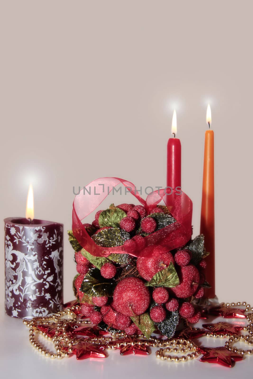 kissing ball against a white background with candles