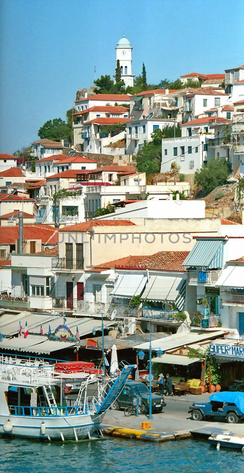 View of clock tower and picturesque greek town