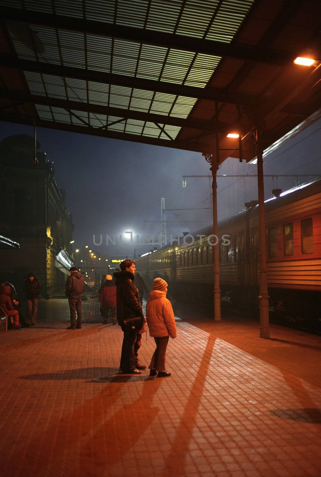 The image of station with people at night