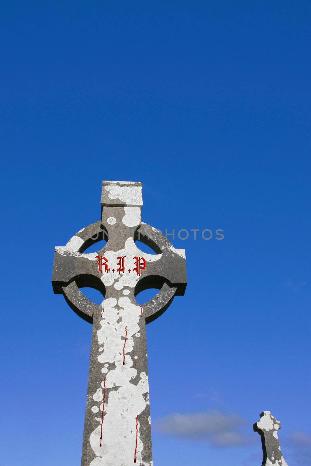 a celtic cross in an irish graveyard