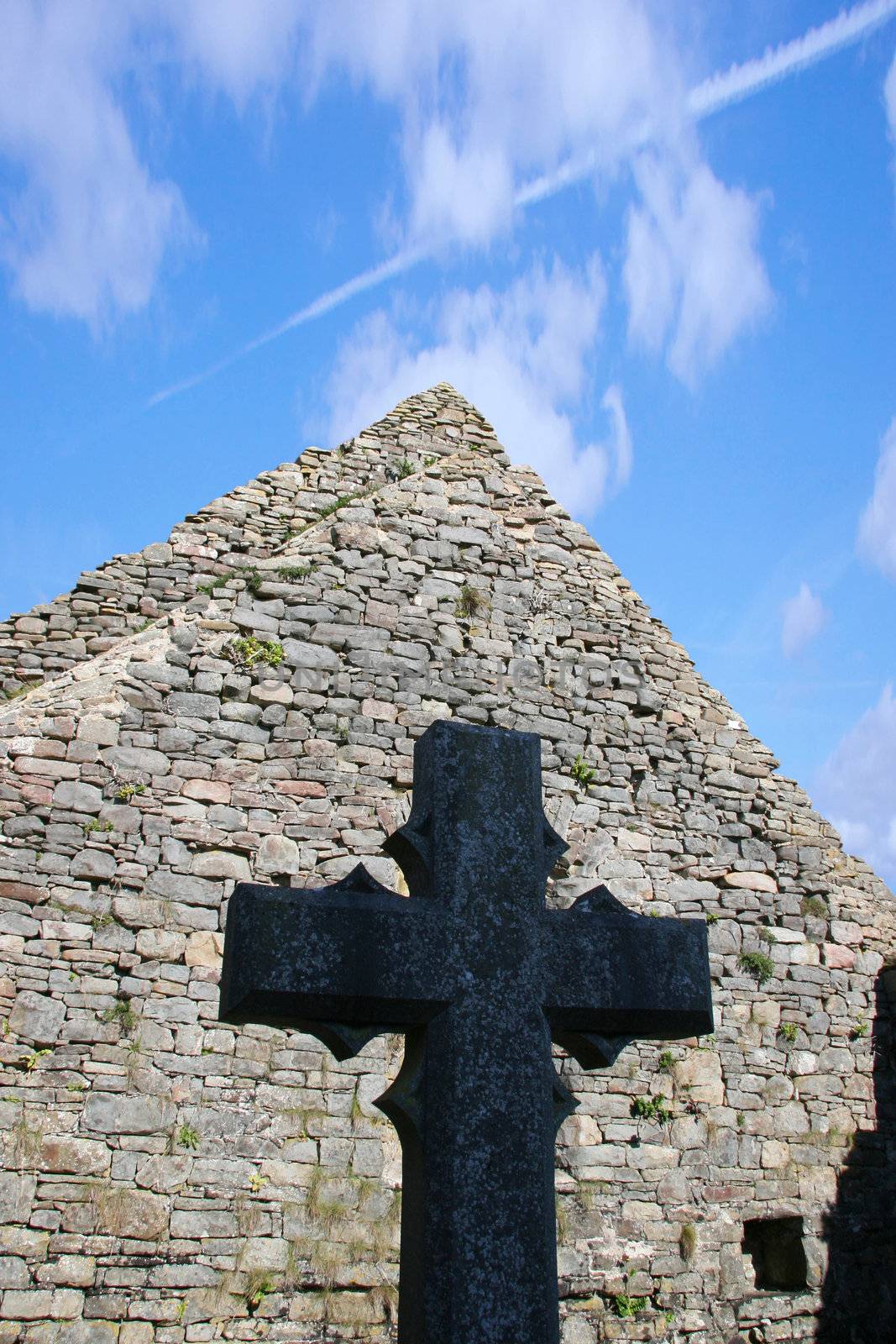 a celtic cross in an irish graveyard