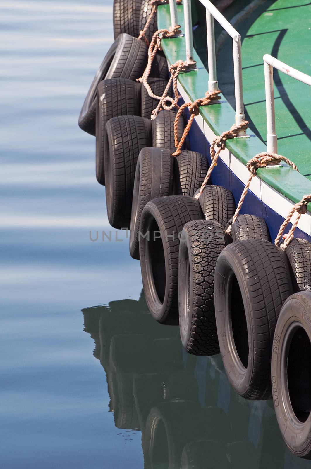 Tyres used like bumpers protecting a boat
