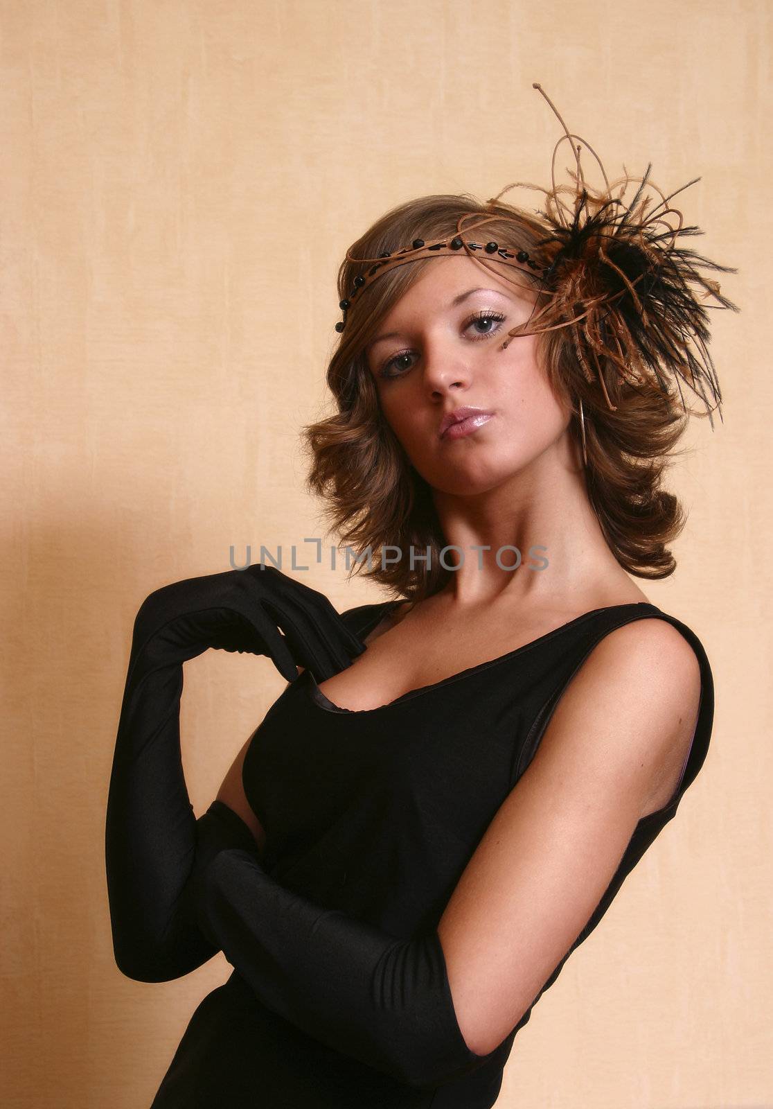 Portrait of the beautiful girl in hat.