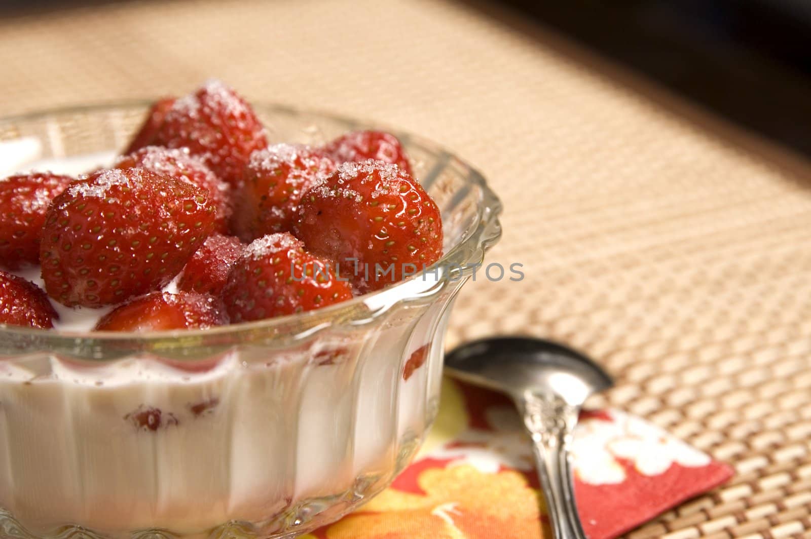 Juicy strawberries with cream, cup, teaspoon, napkin