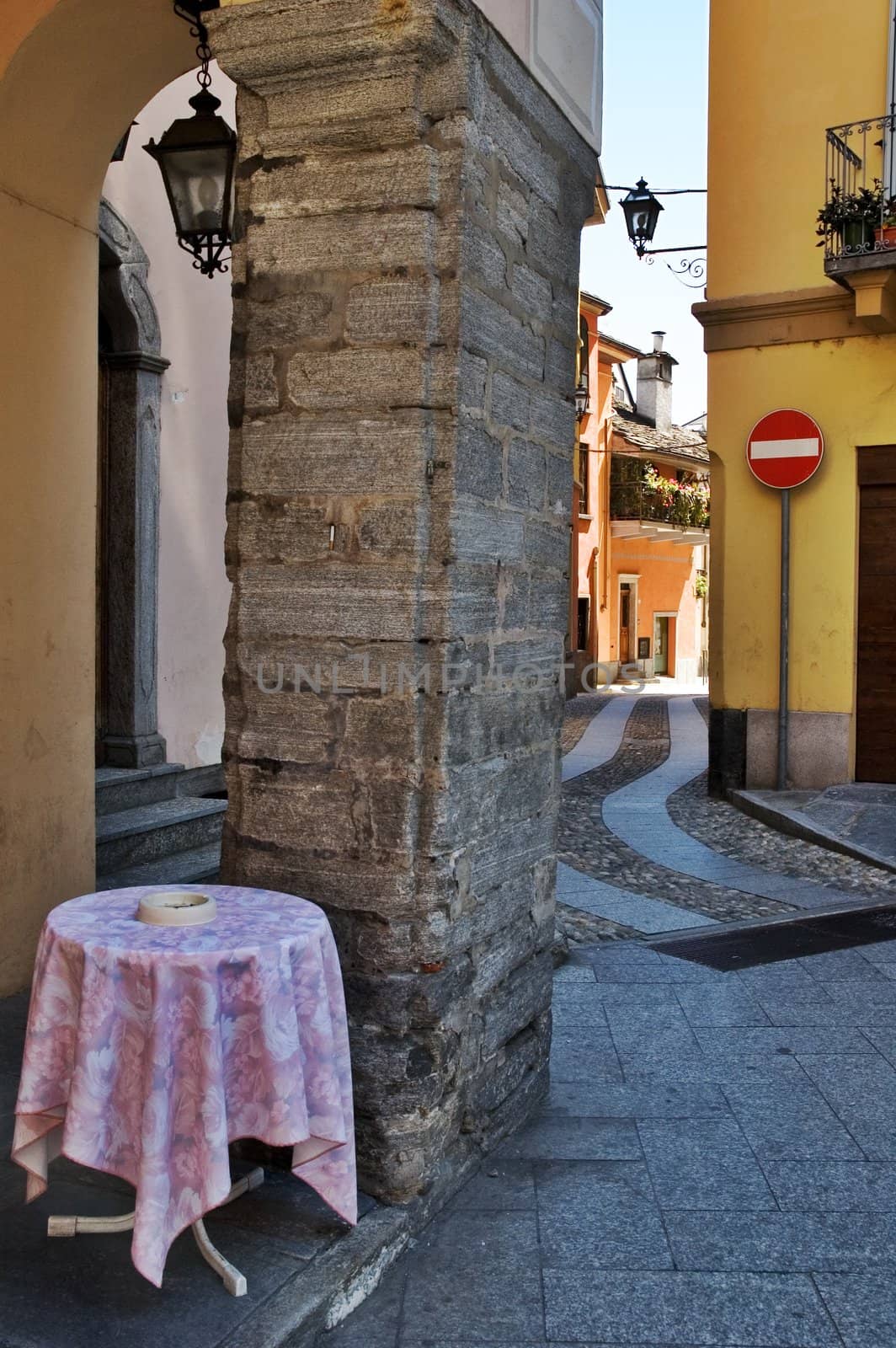 Italian alley with bar table