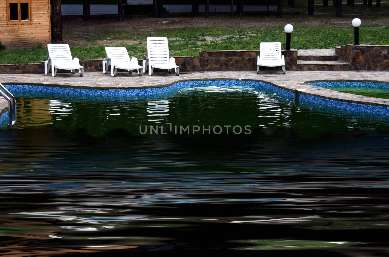 a pool is a decorative landscape design under the opened sky